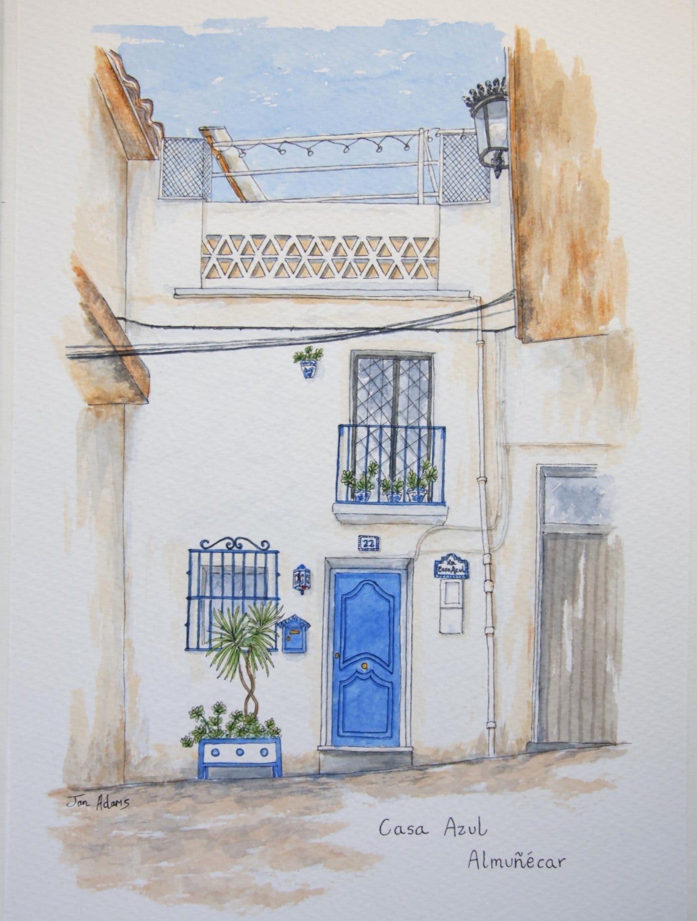 Spanish town house in watercolour and ink with blue door and railings