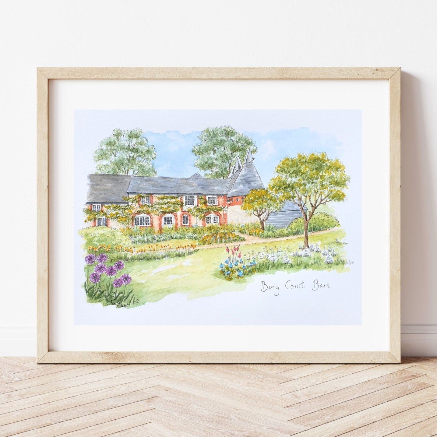 Bury Court Barn with flowers and trees